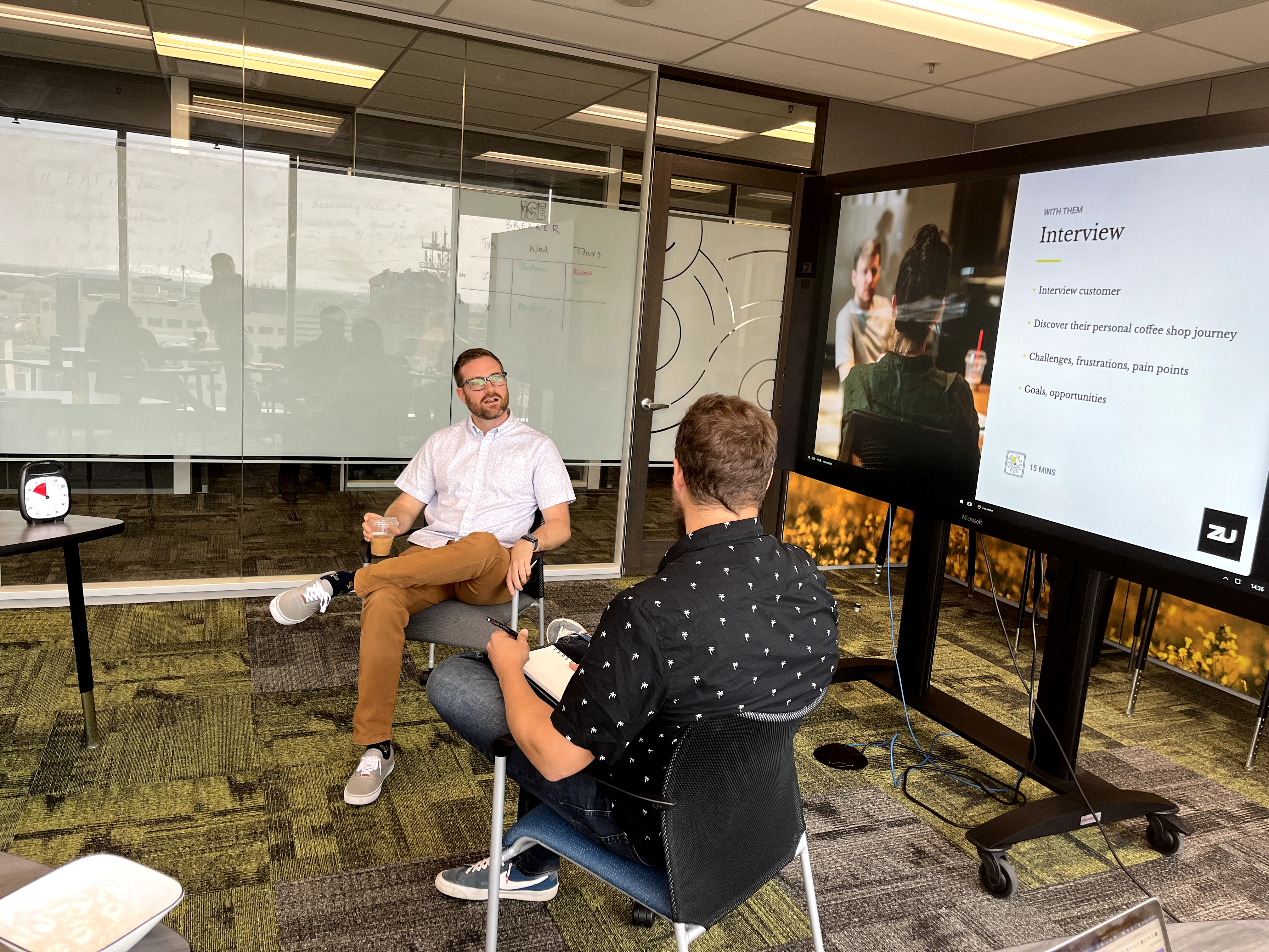 People talking in a conference room.