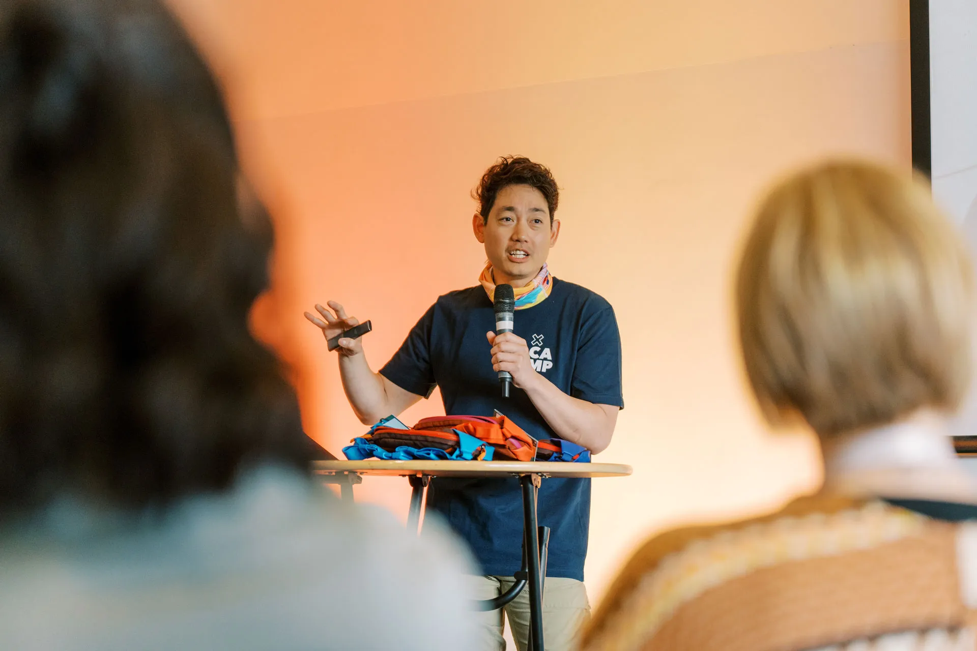 Albert Jame talking in front of a crowd