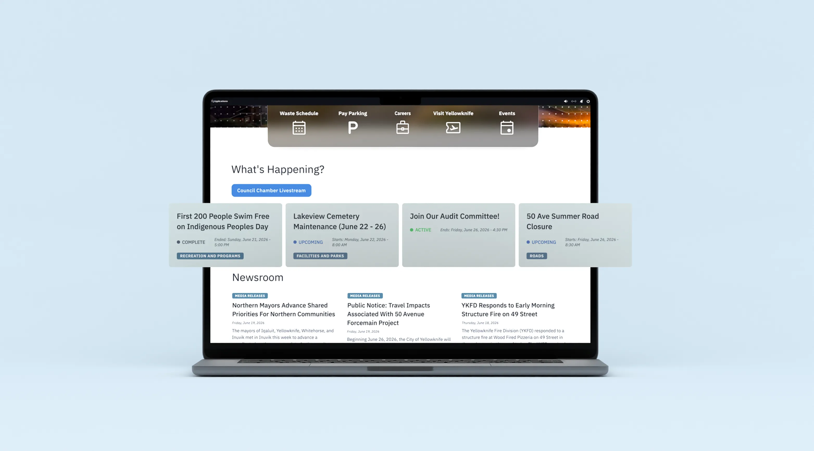 Laptop mockup showing the City of Yellowknife What's Happening section with quick links, service alerts, and newsroom articles