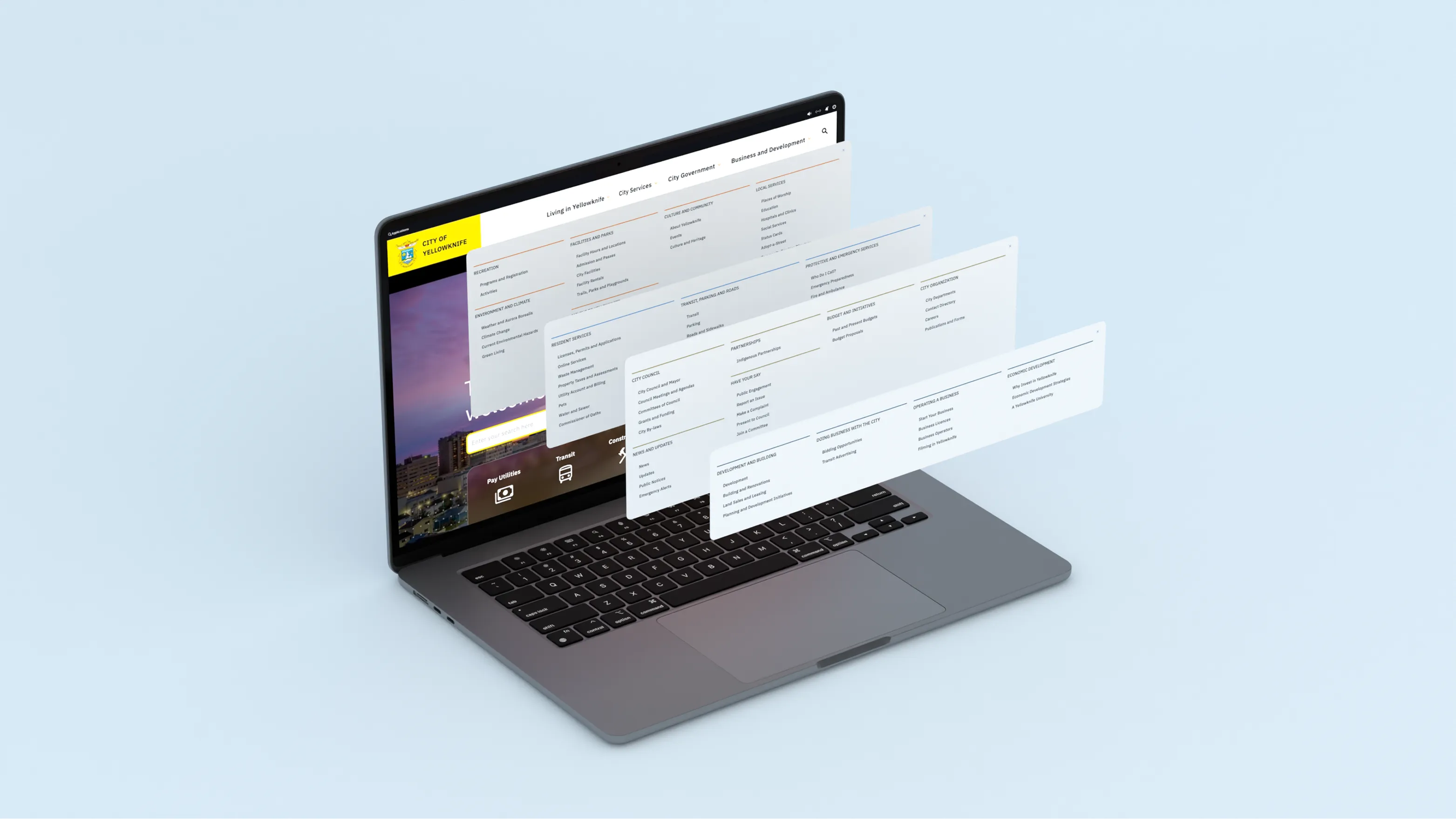 Exploded view of the City of Yellowknife website navigation menus layered above a laptop