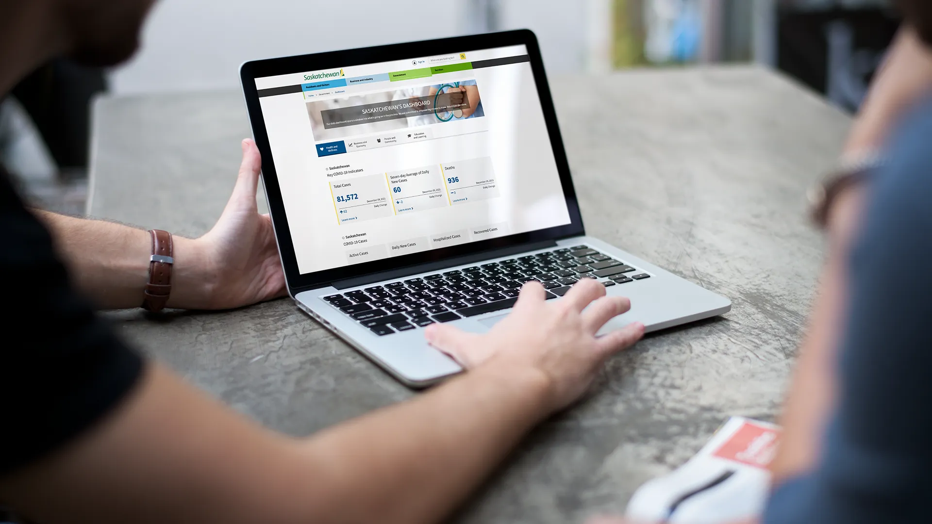 A computer screen displaying Saskatchewan’s online dashboard with regional conditions data, including a highlighted map of the North West region and crop seeding progress statistics.