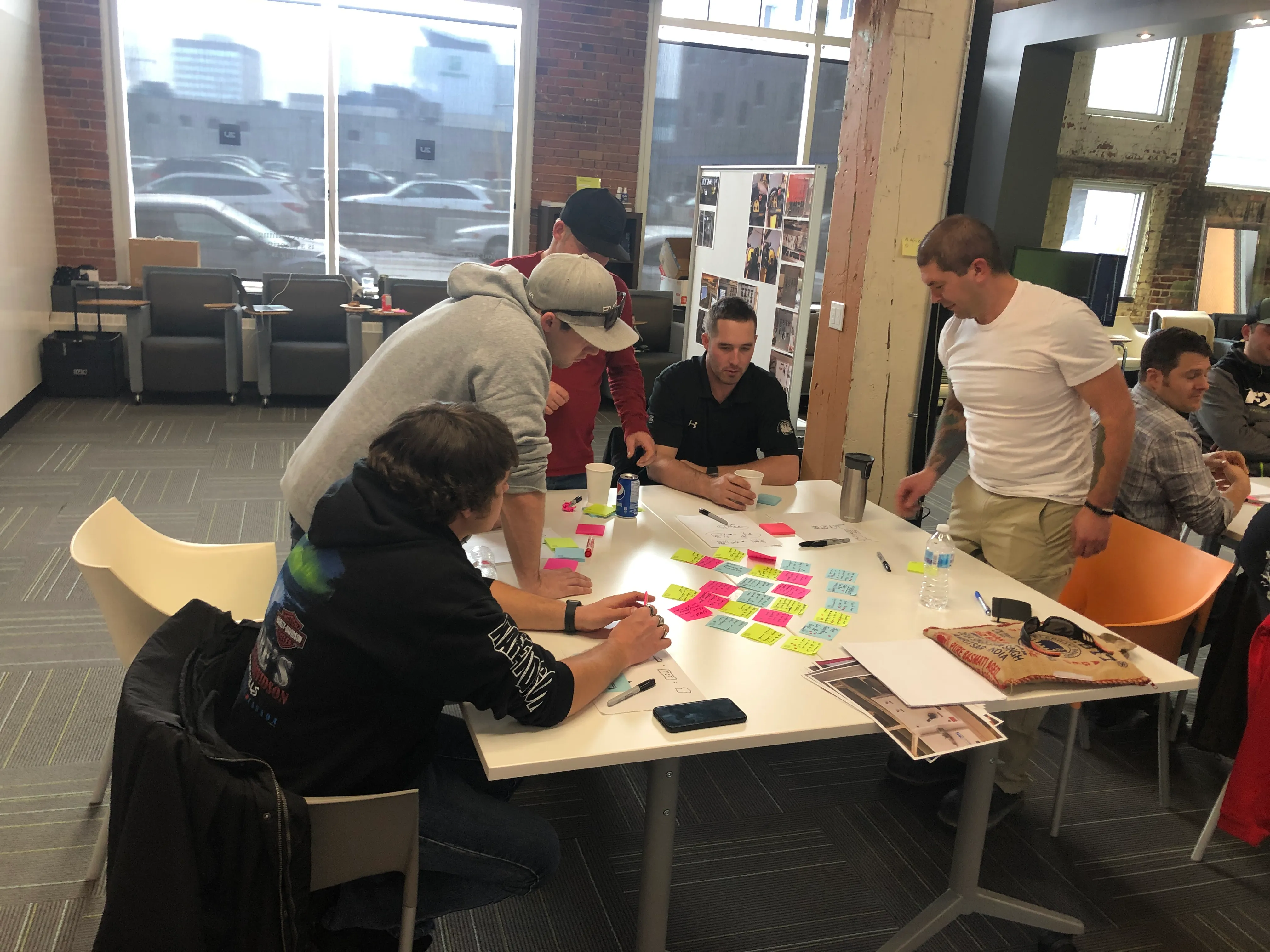 3D concept render of an operator seated at a multi-monitor tele-remote control desk