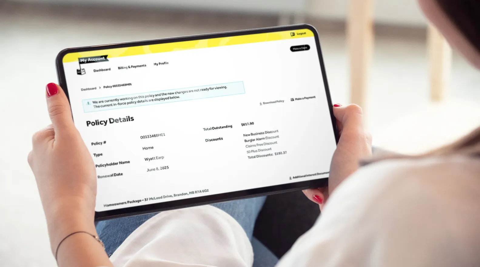 Person holding a tablet showing Sandbox policy details