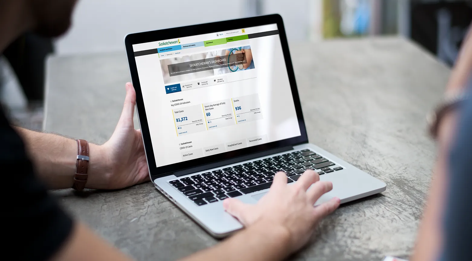 Project workshop session with team members gathered around tables and whiteboards