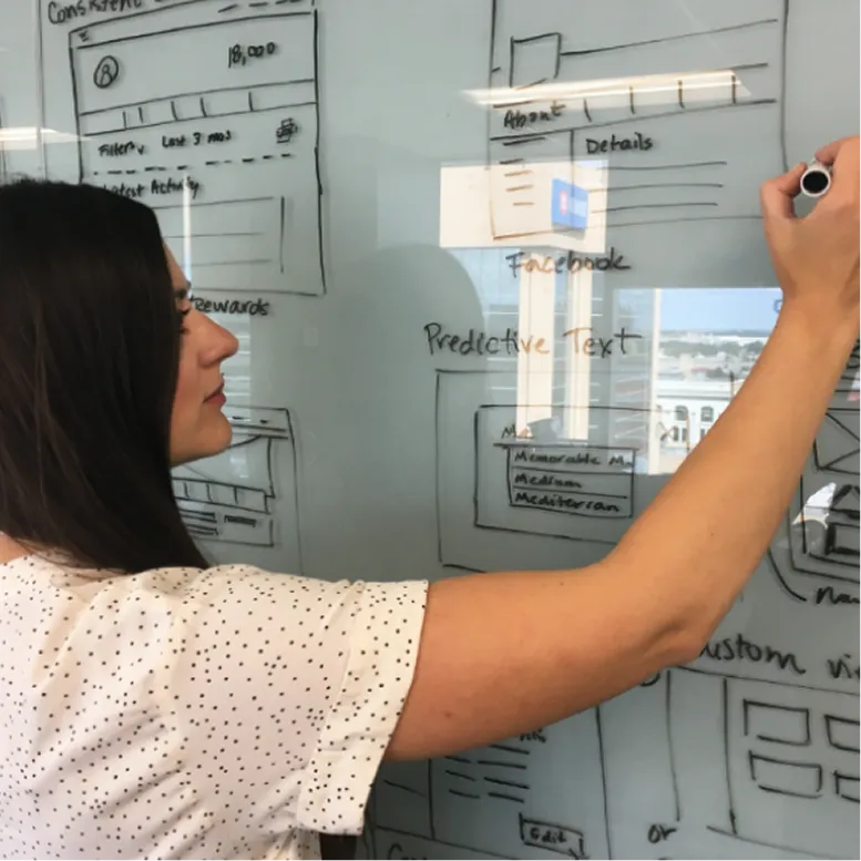 Person using a laptop with Saskatchewan dashboard COVID-19 indicator cards on screen